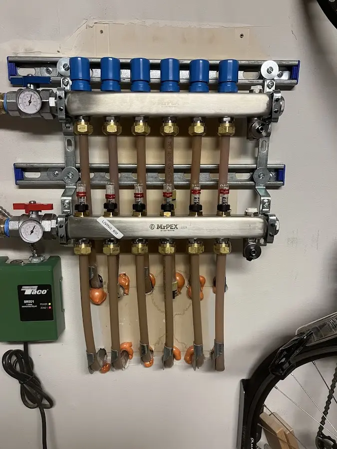 Plumber performing Water Heater Repair at a residential property in Sandy Creek